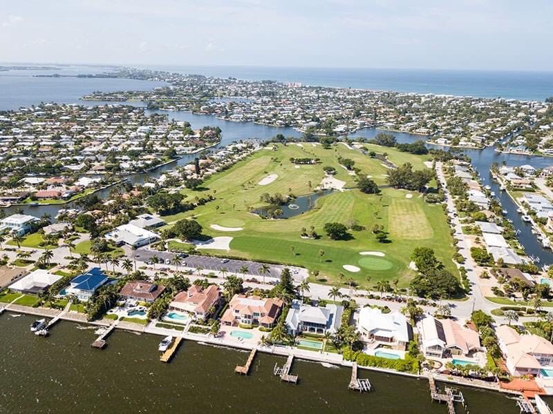 Amenities at Key Royale Club include a driving range, putting green, and a clubhouse with a restaurant and pro shop. Green fees are $32 for nine holes and $52 for 18 holes.