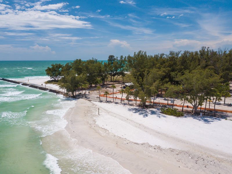 Coquina Beach is well-known for its white sand beaches and clean seas, which make it a sought-after location for beach activities like swimming and tanning.