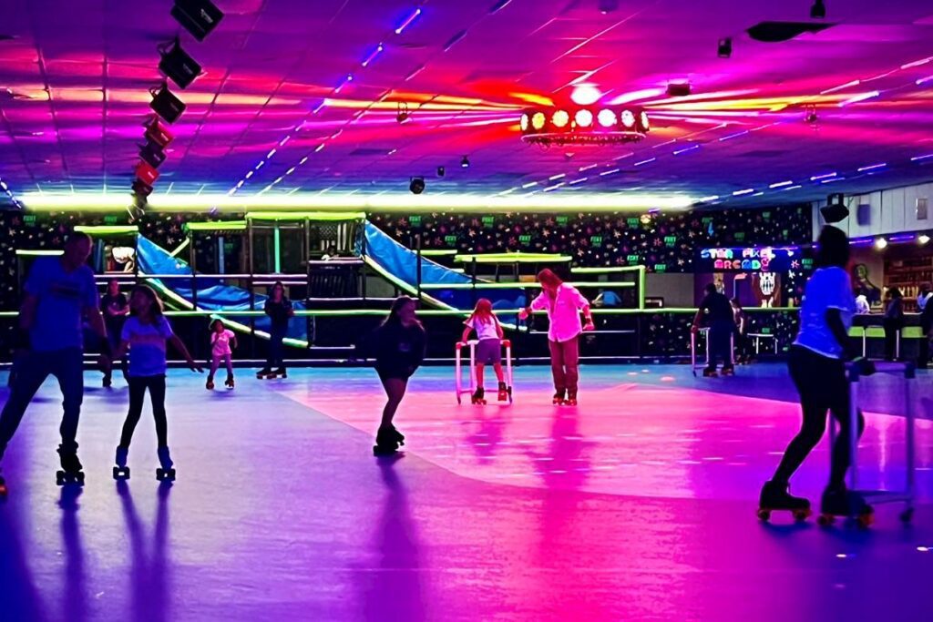 Families of all ages, enjoying their time at the roller skating ring at Fort SK8 Family fun Center.