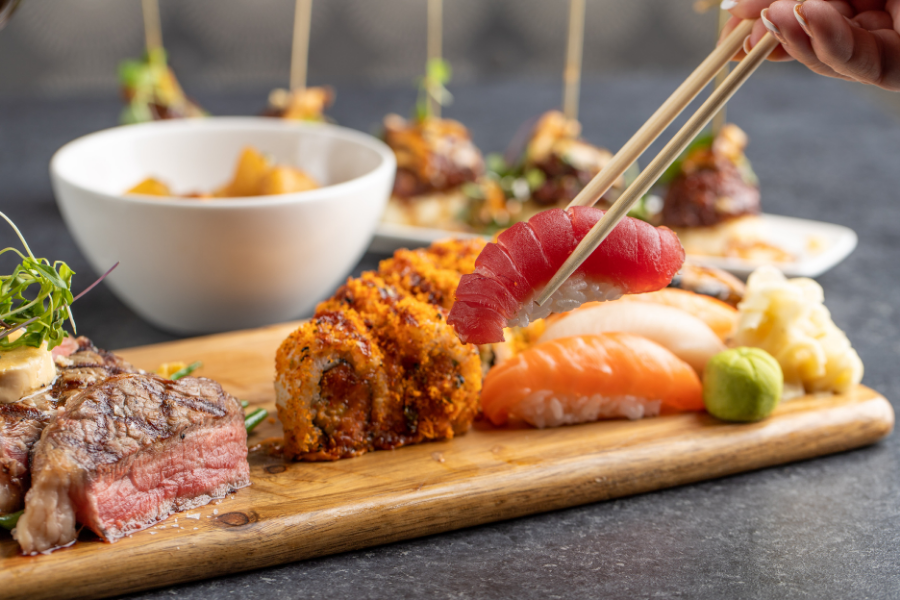 A mixed platter of rolls, sashimi and steak - an example of the variety in menu options at the Kona Grill in Sarasota