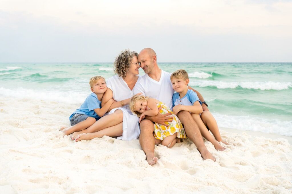 A family of 5, having the best time on Navarre Beach. This photo was taken by Whitney Sims Photography.