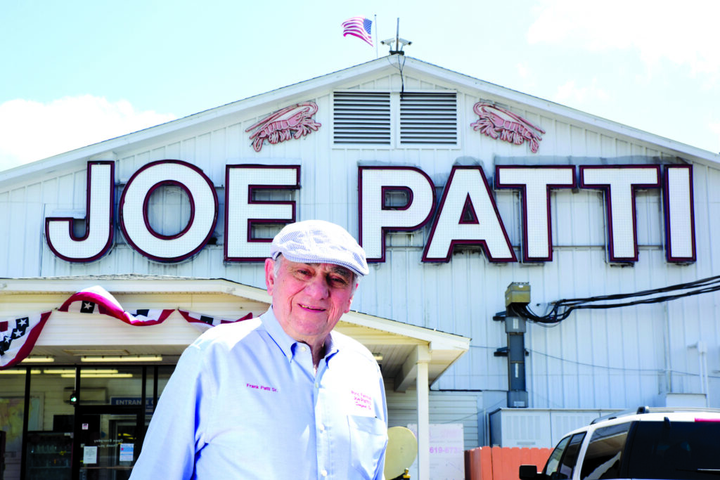 Frank Patti, standing outside of Joe Patti's Seafood Market, in Pensacola, Florida.